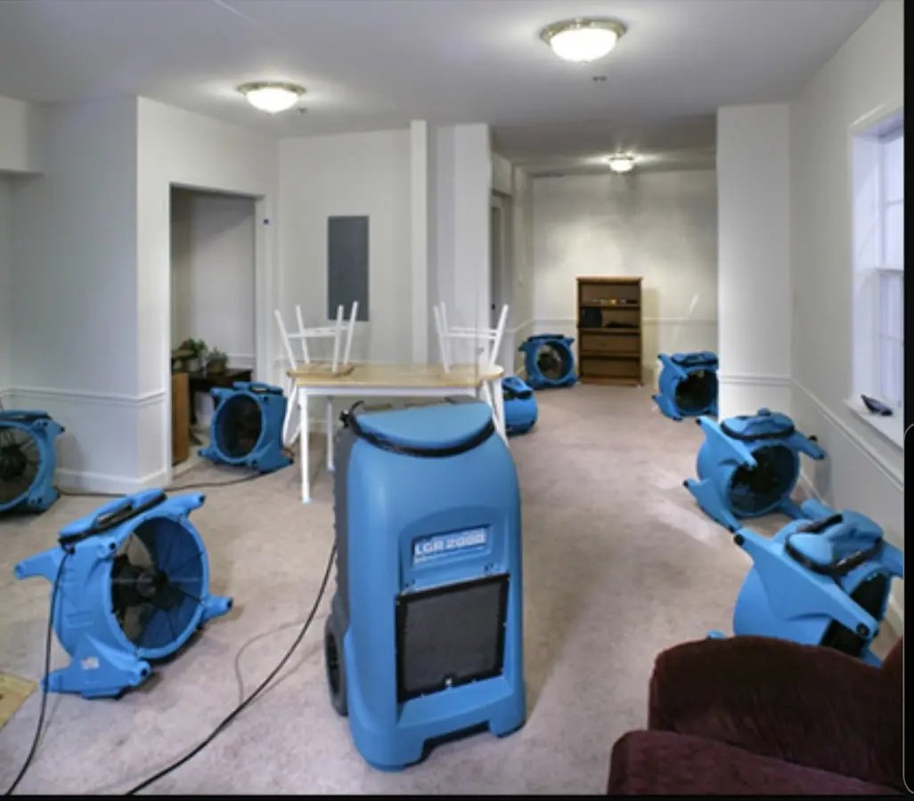 Air movers and dehumidifier setup for Water Damage Restoration in Hollins